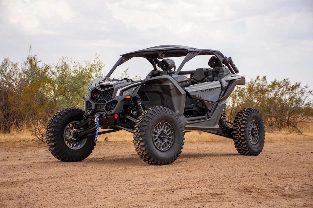 Raceline-Podium-11-1536x1024.jpg A Can-Am UTV on dirt roads.