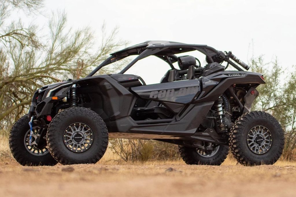 A Can-Am Raceline UTV was on a dirt road.